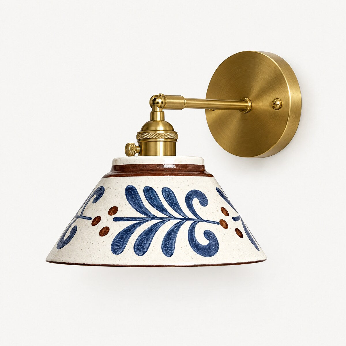 Birk hand-painted ceramic wall light in Blue Fern with brushed brass arm