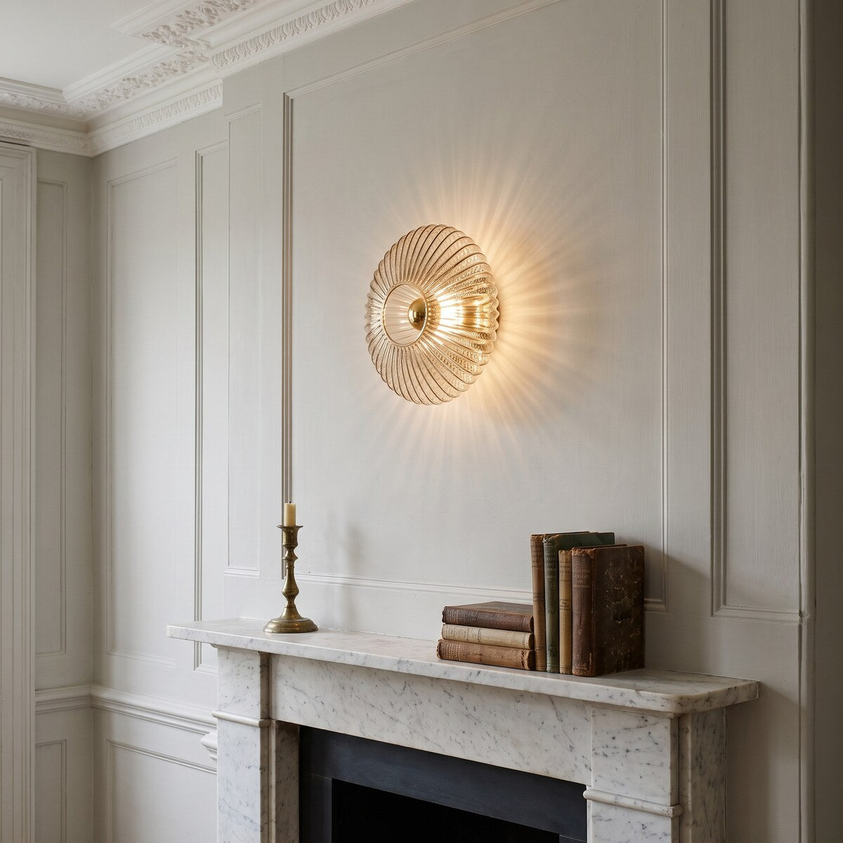 Dahlia smoke grey glass wall light above a marble fireplace in a period drawing room
