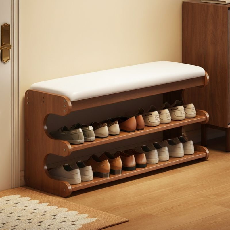 Dorvyn bamboo shoe bench with shoes on both shelves beside a front door