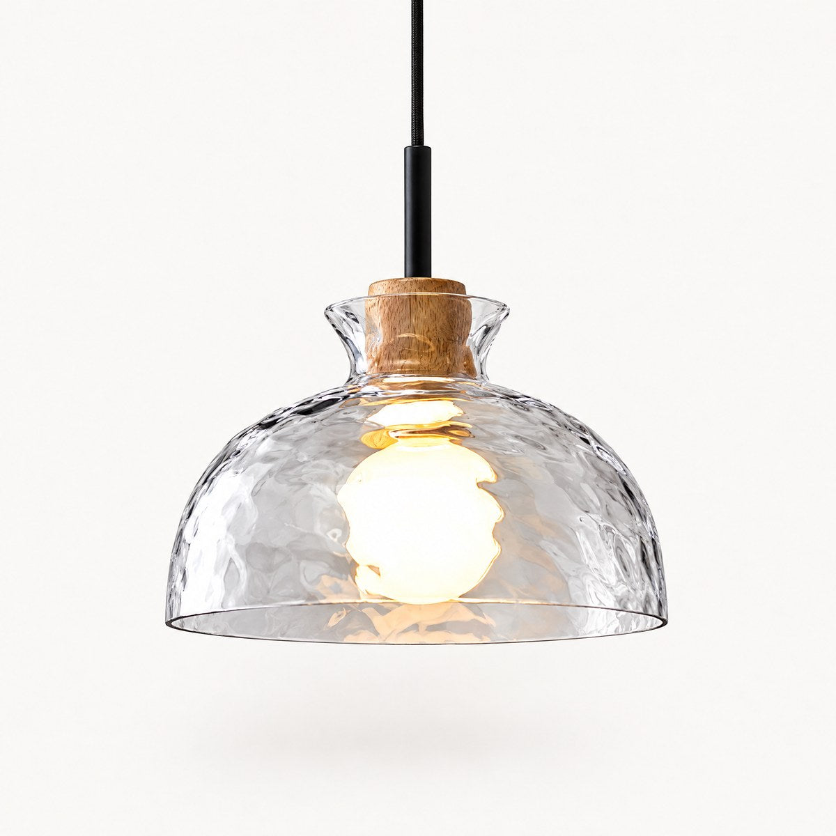 Fjord rippled glass bowl pendant light with natural wood cap, lit, on white background