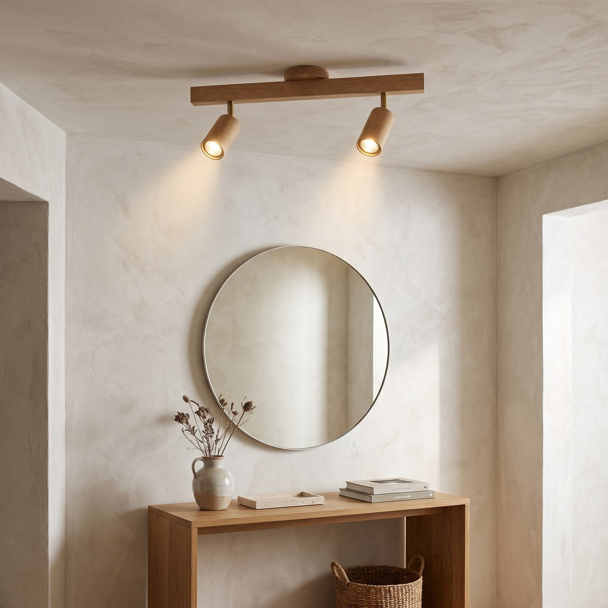 Holt two-head oak spotlight above a console table in a limewashed hallway