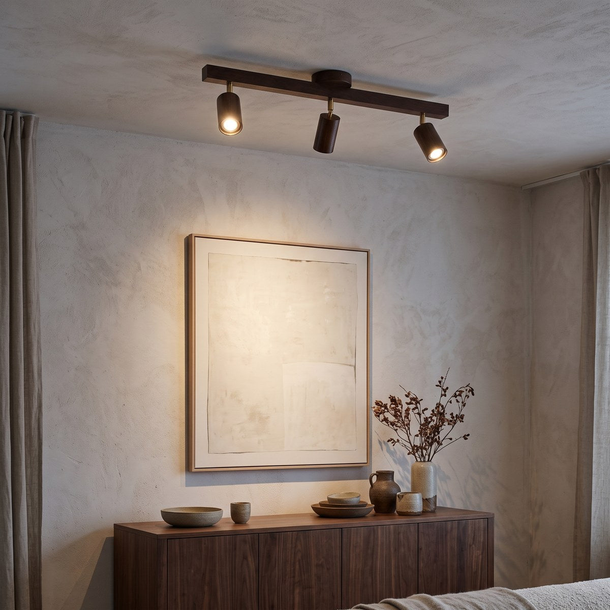 Holt three-head walnut spotlight lighting artwork above a walnut sideboard