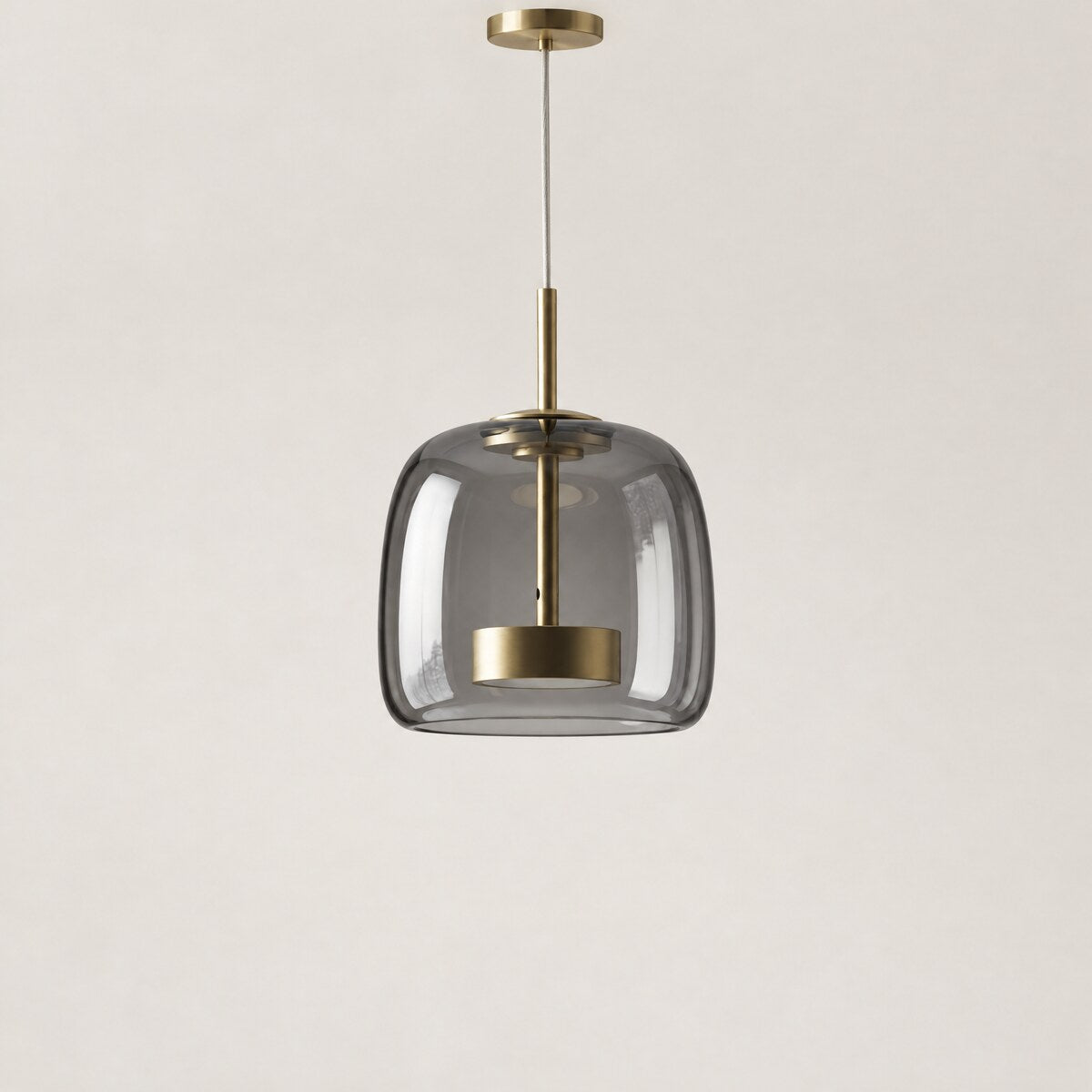 Kelda smoke grey glass pendant light with brass LED core