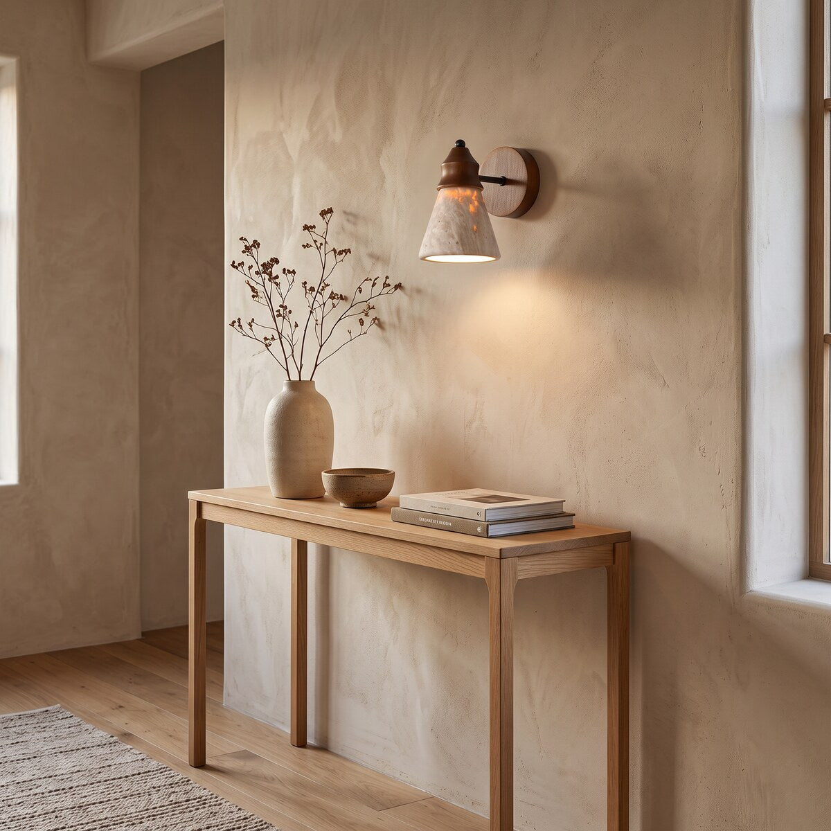 Tufa travertine wall light lighting an oak hallway console
