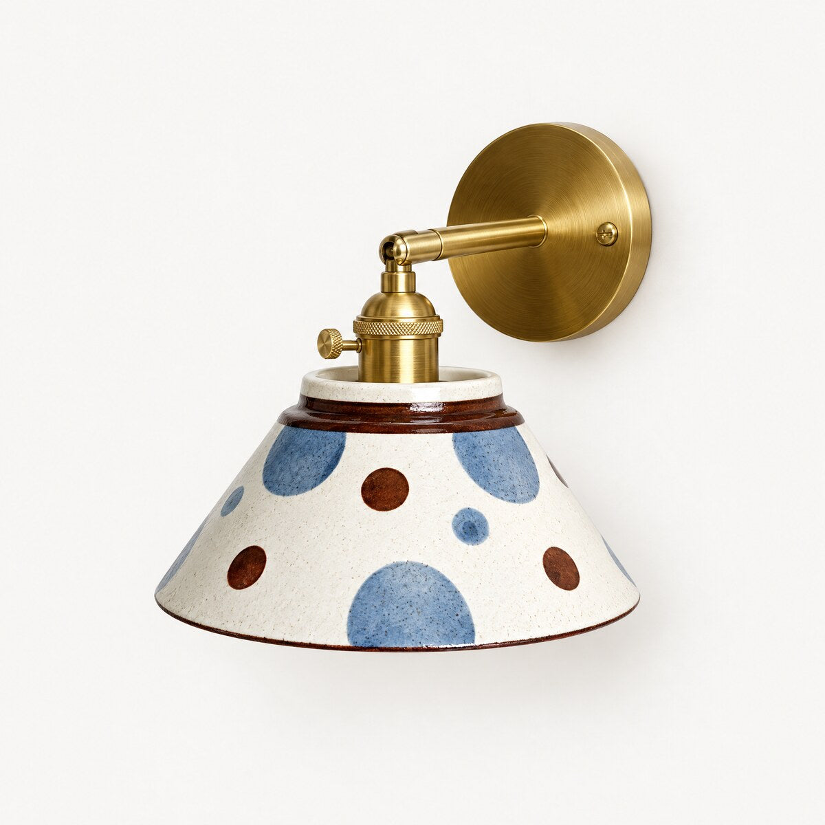 Birk hand-painted ceramic wall light in Polka with brushed brass arm