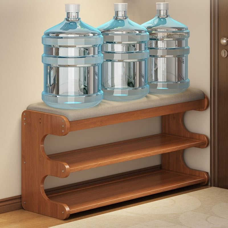 Dorvyn shoe bench supporting heavy water bottles to show its strength