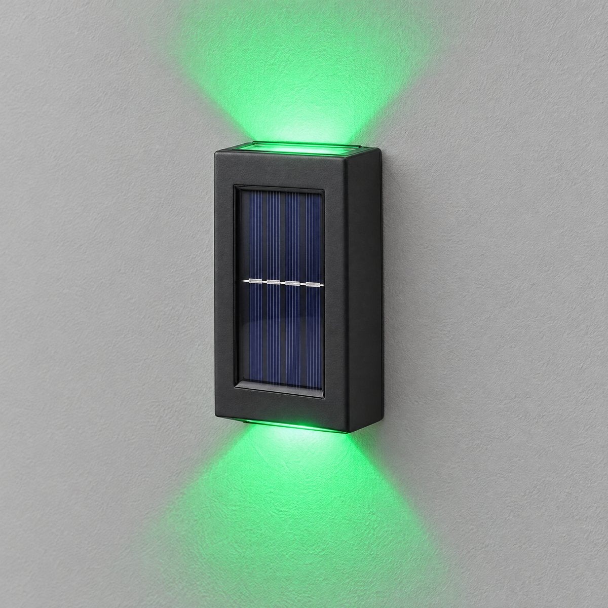Glint colour-changing solar up and down wall light glowing green