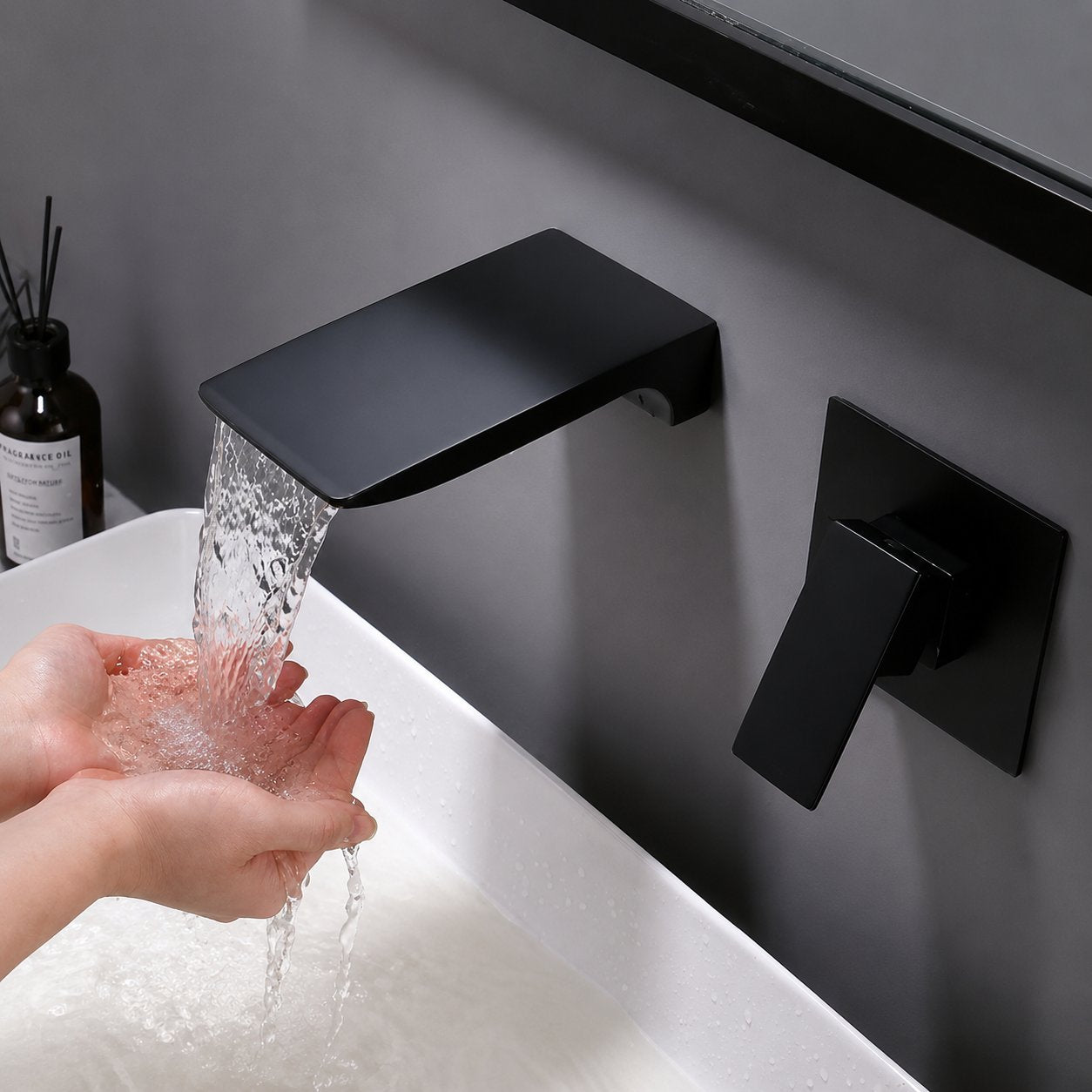 Kelsye Wall Mounted Bathroom Taps in Chrome, Black, and Gold Finishes with Waterfall Design