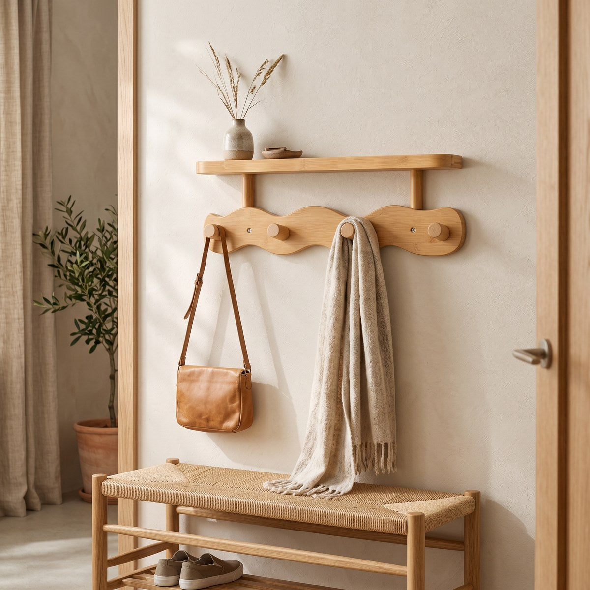 Onda oak 4-peg coat rack with shelf holding a leather bag and scarf above a woven oak bench in a hallway