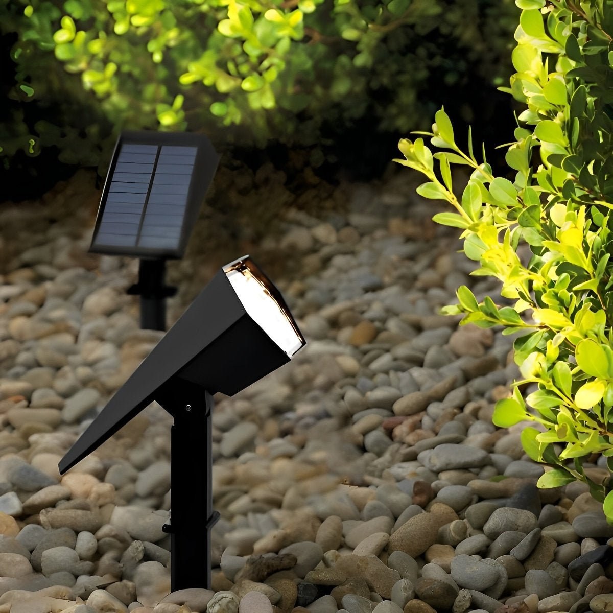 Sunpeak solar spotlight in a gravel garden showing the solar panel